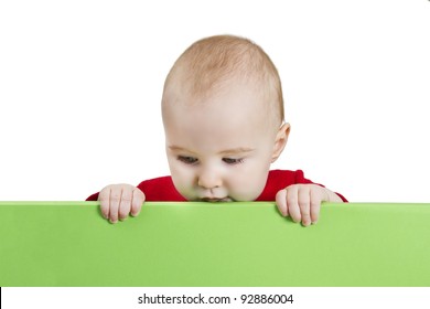young child presenting green shield. isolate on white background