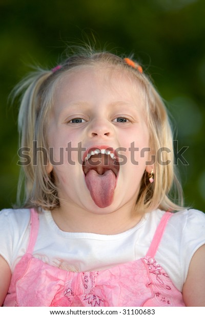 young-child-stick-her-tongue-out-stock-photo-edit-now-31100683