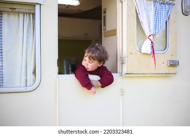 Young Child In A Vintage Caravan