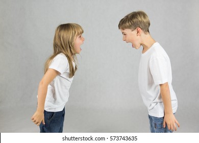 Young Children Fighting And Shouting At Each Other