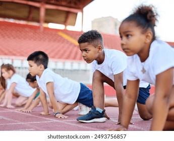 Young children having athletic exercise class running on the track, healthy lifestyle and children sport education concepts, start line preparation for the race - Powered by Shutterstock