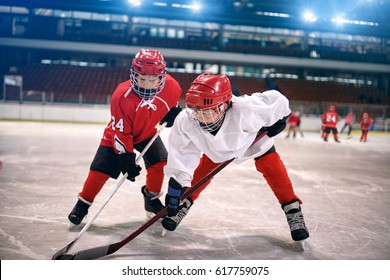 Young Children Play Ice Hockey
