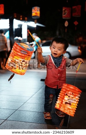 Young children playing lantern during Zhong Qiu Jie, Chinese Lantern Festival