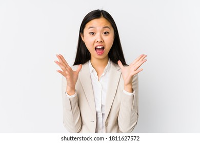 Young Chinese Business Woman Isolated Celebrating A Victory Or Success, He Is Surprised And Shocked.