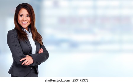 Young Chinese Business Woman Over Office Background