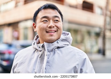 Young Chinese Man Smiling Confident Standing At Street