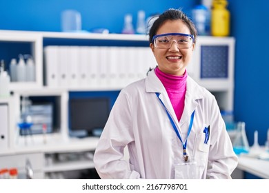 Young Chinese Woman Scientist Smiling Confident Standing At Laboratory