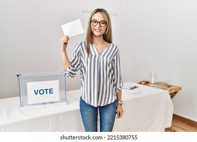 Young Chinese Woman Smiling Confident Holding Vote At Electoral College