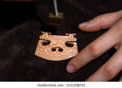 Young Chinese Woman Violin Maker Signs The Jumper Of Her Violin With Fire With Her Name In The Workshop