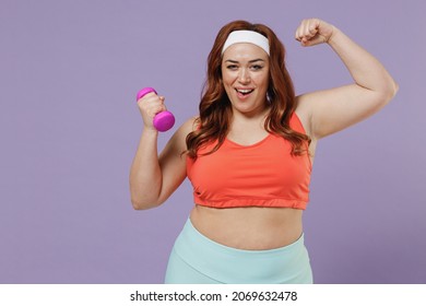 Young Chubby Overweight Plus Size Big Fat Fit Woman 20s Wear Red Top Warm Up Training With Dumbbells Show Biceps Muscles Power Isolated On Purple Background Home Gym Workout Sport Motivation Concept