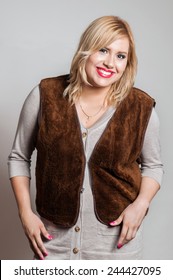 A Young Chubby Woman Posing In A Studio