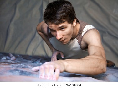 Young Climber Climbs A Semi-climbing Wall