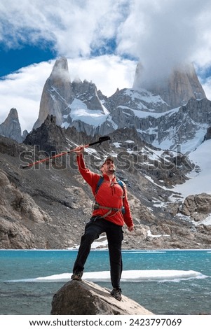 Young climber reaching his goal. Young climber happy to have reached Fitz Roy in Argentina. Happy man managing to reach Fitz Roy.