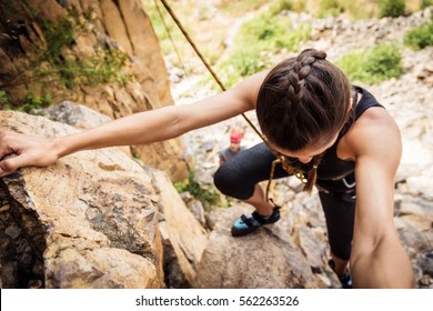 Young Climbers Rock Climbing In Old Quarry