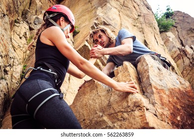 Young Climbers Rock Climbing In Old Quarry