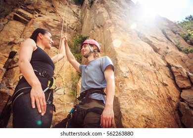 Young Climbers Rock Climbing In Old Quarry