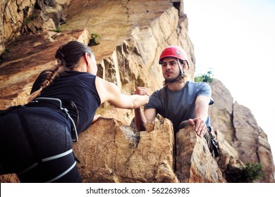 Young Climbers Rock Climbing In Old Quarry