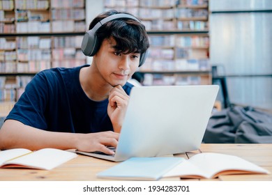 Young Collage Student Using Computer And Mobile Device Studying Online. Education And Online Learning. 