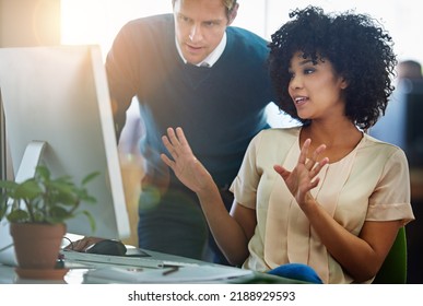 Young colleagues collaborating and planning for innovation, vision or mission for a business. A team of employees working together to help each other on a project of company growth and strategy. - Shutterstock ID 2188929593