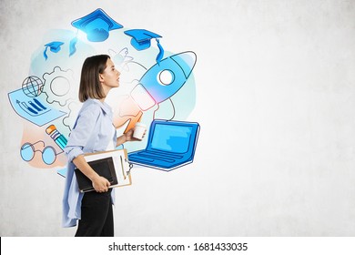 Young College Girl With Long Fair Hair, Coffee To Go And Notebooks Walking Near Colorful Education Sketch Drawn On Concrete Wall. Concept Of Knowledge, Science And Graduation. Mock Up