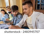 Young college students preparing for exam or working on group project