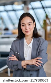 Young confident Asian business woman entrepreneur, elegant professional company manager, successful businesswoman executive leader wearing suit standing in office with arms crossed. Vertical portrait - Shutterstock ID 2179380683