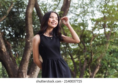 A Young Confident Asian Woman With Cute Dimples Feeling Happy. Smiling About Her Beautiful And Glowing Skin.