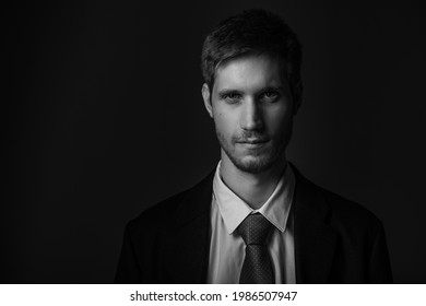 Young Confident Caucasian Man In Suit In Black And White. Business Concept