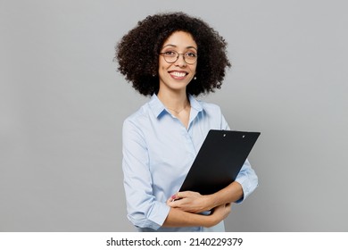 Young Confident Employee Business Corporate Lawyer Woman Of African American Ethnicity In Classic Formal Shirt Work In Office Clipboard With Papers Document Isolated On Grey Color Background Studio