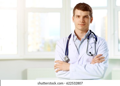 Young and confident male doctor portrait. Successful doctor career concept. 