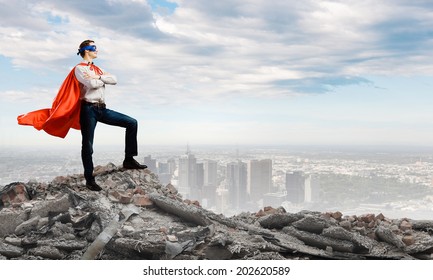 Young confident man in mask and cape - Powered by Shutterstock