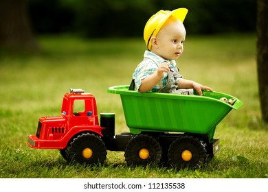 young constructor sitting in the car