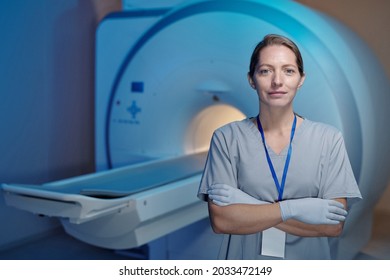 Young Contemporary Clinician Crossing Arms By Chest While Standing Against Mri Scan Equipment