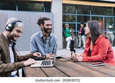 Young content creator journalist recording informal interview conversation with modern woman. Trendy millennial people making podcast for online social media radio networks. Focus on bearded man - Shutterstock ID 2058930752
