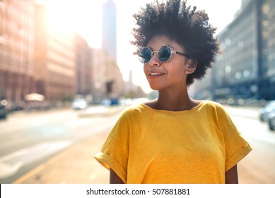 Young Cool Black Skin Girl Walking In The Street.