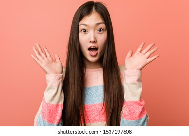 Young Cool Chinese Woman Surprised And Shocked.