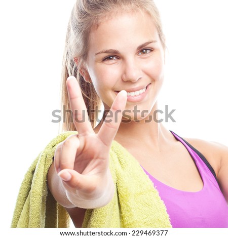 young cool woman with a dumbbell, victory gesture