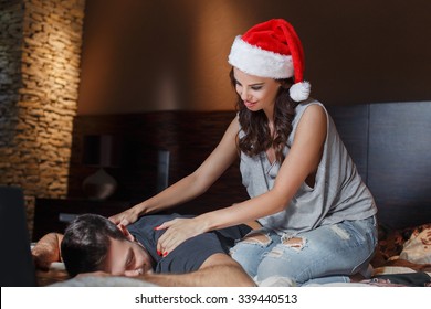 Young Couple Back Rub On Bed At Home, Santa Woman Massaging Man