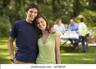 Young Couple In Back Yard, Portrait