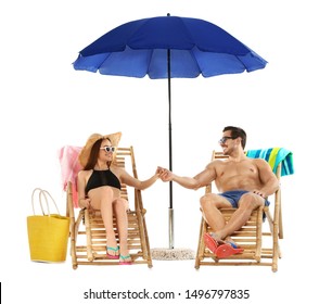 Young couple with beach accessories on sun loungers against white background - Powered by Shutterstock