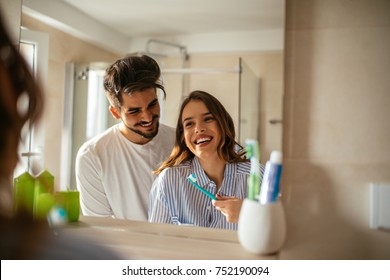 Young Couple Bonding Trough Morning Routine. 