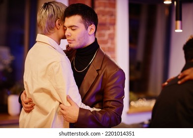 Young Couple Of Boyfriends In Smart Casualwear Standing In Embrace During Slow Dance While Enjoying Home Party In The Evening