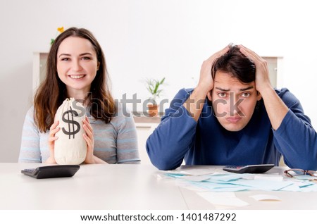 Young couple in budget planning concept 
