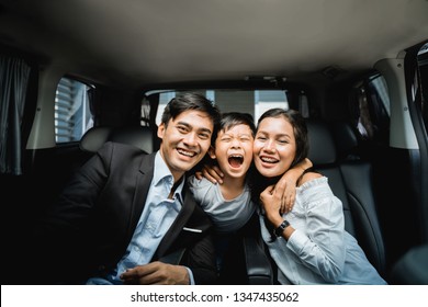 Young Couple Business Family With Their Kid, Ready To Go By Car