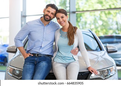 Young Couple Buying A Car
