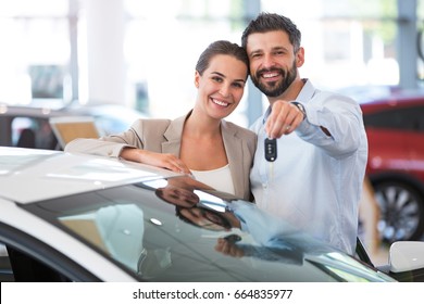 Young Couple Buying A Car
