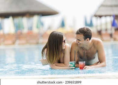 Young Couple By The Pool