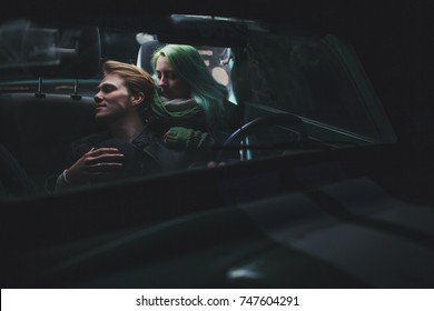 Young Couple In A Car At Night