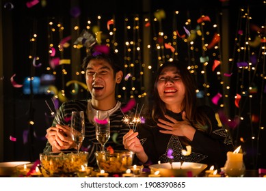 Young Couple Celebrate At Night Party, Romance Date And Love Concept For Valentine's Day, Dinner With Night Candle Light, Cozy With Couple Family At Home