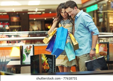 Young Couple Checking Their Shopping Bags